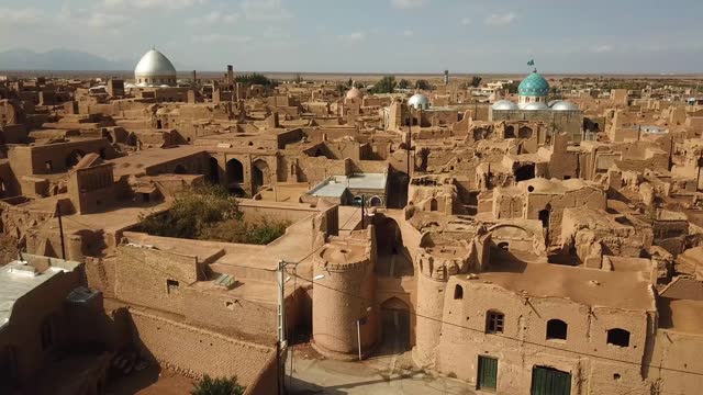 wonderful ancient architecture design in historical city of aqda in Yazd in Iran town in castle adobe houses mud brick structure clay building travel to history and frozen ruins of civilization iran