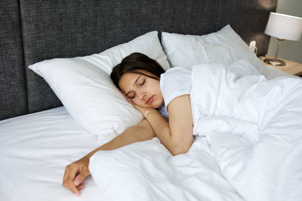 istock A young attractive girl is sleeping in bed. Morning, 1684819675
