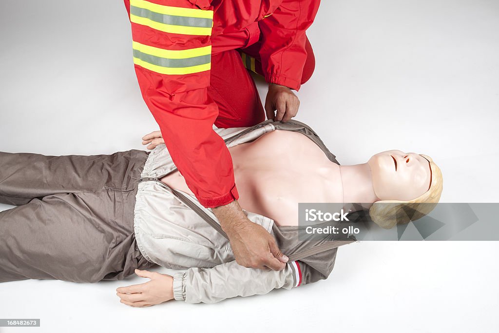 First aid - remove clothing First aid - remove clothing, prepare for cpr Absence Stock Photo