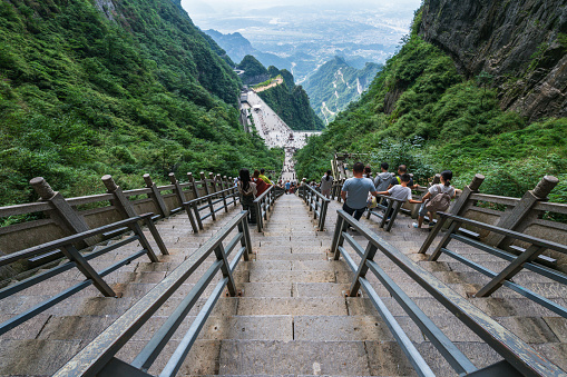 Zhangjiajie, August 30, 2023 :Tourists on the steps of Heaven's Gate