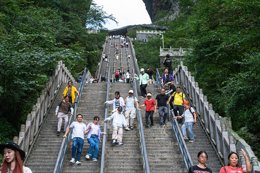 Zhangjiajie, August 30, 2023 :Tourists on the steps of Heaven's Gate