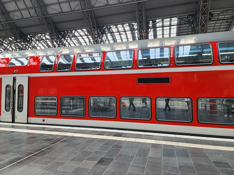 Frankfurt Train Station and red passenger train Serving citizens and tourists every day in Germany.