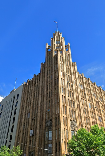 Art Deco-Gothic inspired twelve-storey building on the Collins and Swanston Streets northwest corner built in AD 1931-32 with a stepped tower reaching a total 64 metres high. Melbourne-VIC-Australia.