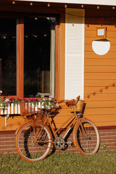 Vintage Bicycle Against Cottage Wall