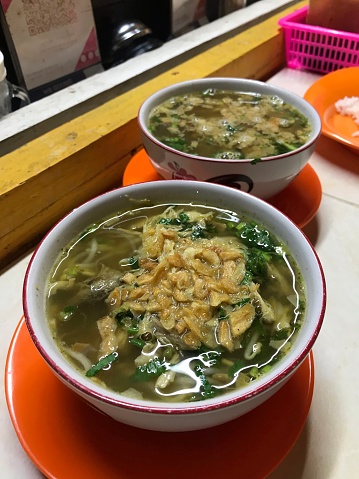 Soto Semarang. Traditional chicken soup and rice from Semarang, Central Java. Served with white bowl