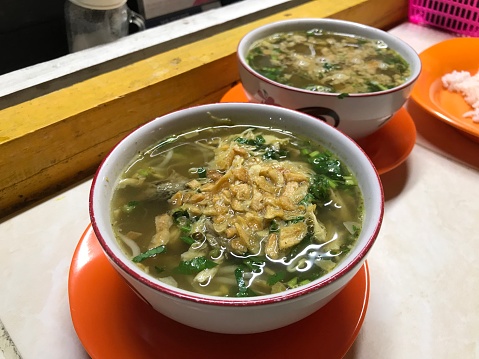 Soto Semarang. Traditional chicken soup and rice from Semarang, Central Java. Served with white bowl