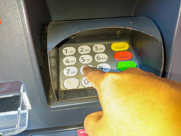 istock a hand presses the ATM keypad 1684888679