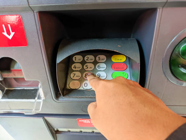 istock a hand presses the ATM keypad 1684888690
