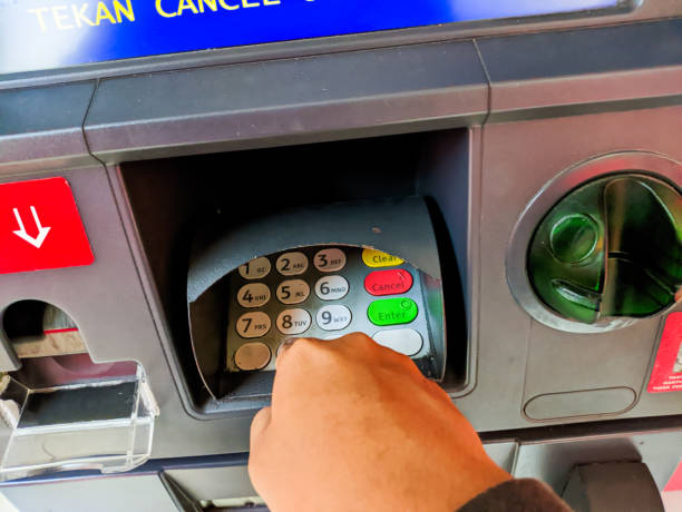 istock a hand presses the ATM keypad 1684888696