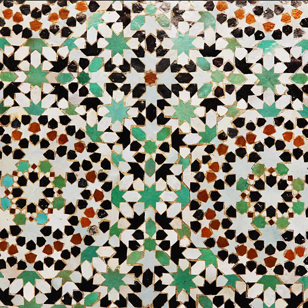 Wooden slat ceiling painted with traditional Moroccan motifs.