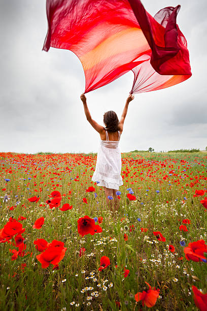 istock Woman with poppy flowers 168491078