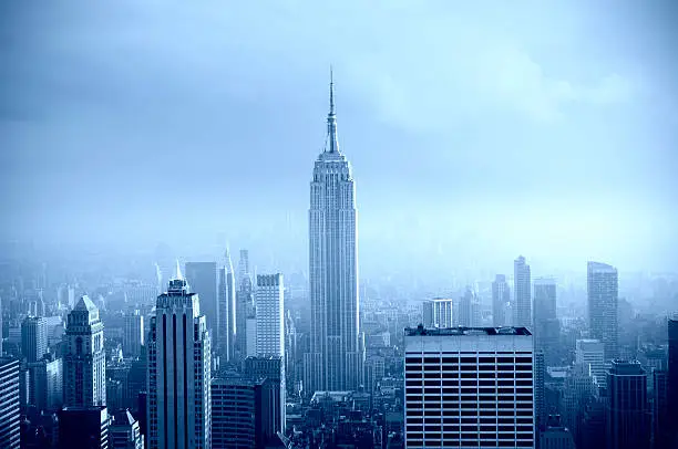Photo of Manhattan Skyline in the Fog, NYC. Blue Toned.