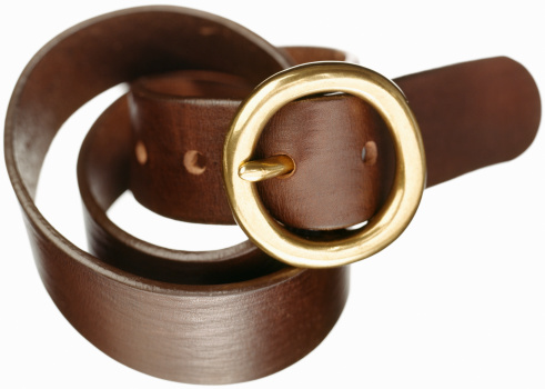 A brown leather belt isolated on a white background