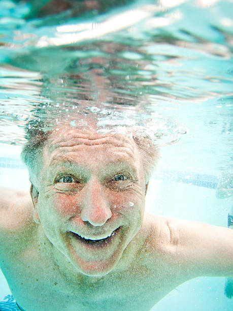 istock Senior Adult Big Smile Underwater 168494774
