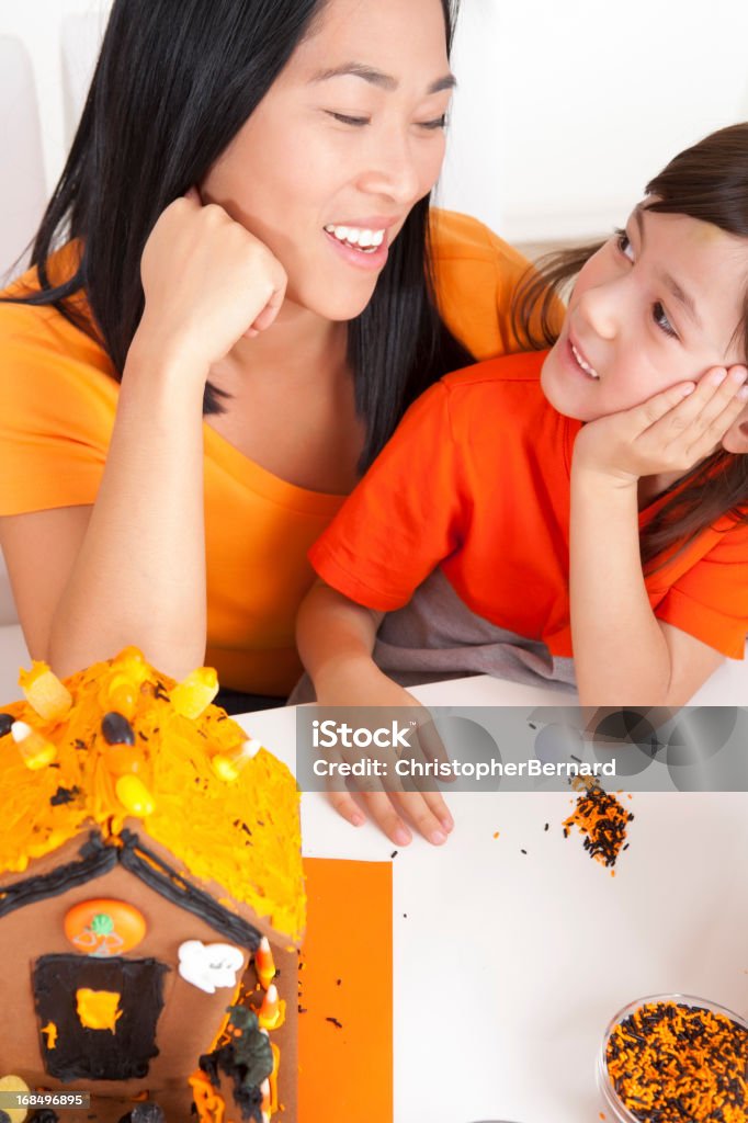 Mother and daughter celebration halloween Mother and daughter decorating for halloween 25-29 Years Stock Photo