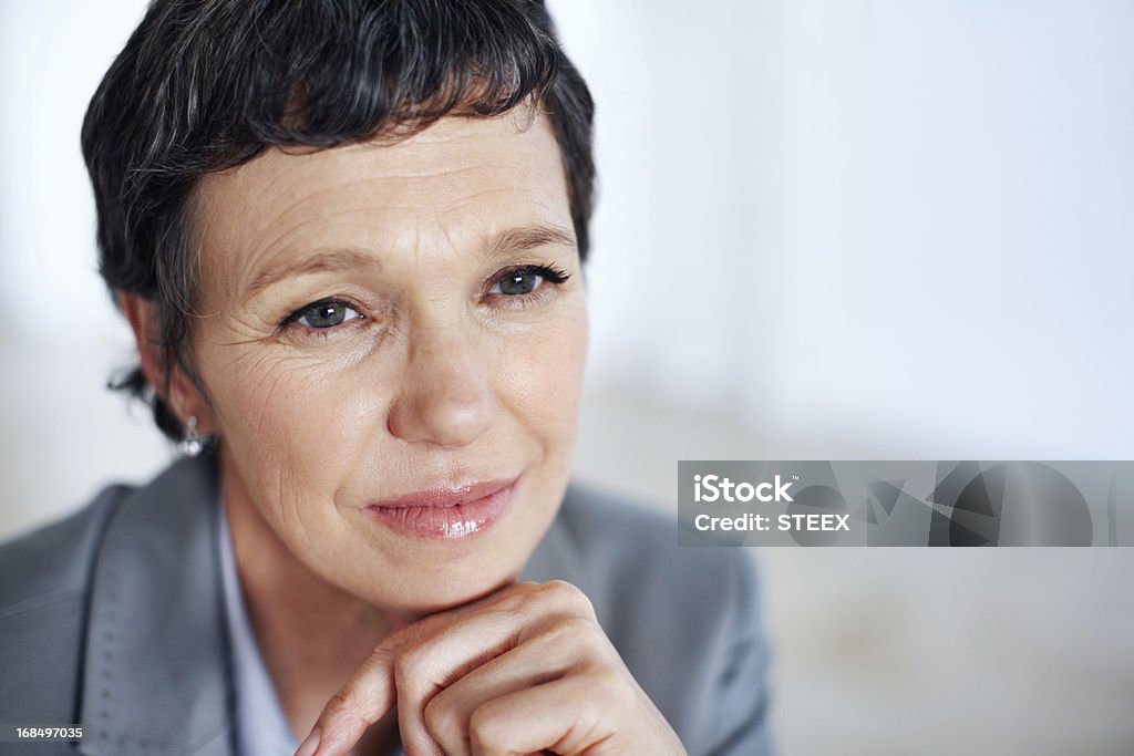 Business woman contemplating Closeup of pensive female executive lost in thought 40-49 Years Stock Photo