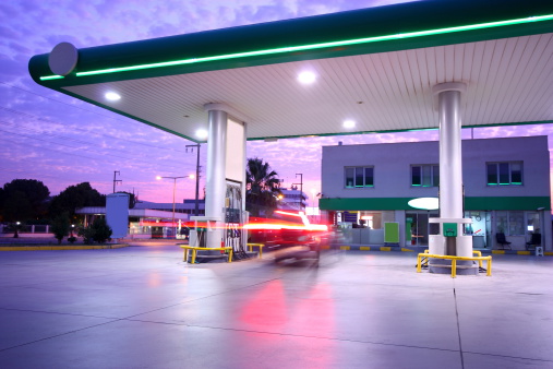 Repsol company service station, at night and in fog.