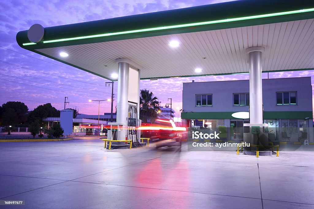Beautiful long exposure photograph of a refueling station Illuminated Service station at night. Gas Station Stock Photo