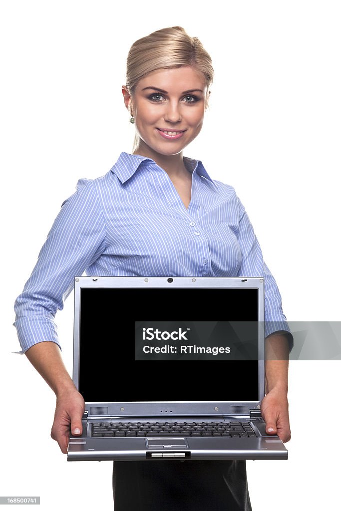 Blond busineswoman holding a laptop with copy space An attractive blond businesswoman holding a laptop with clipping path for the screen to add your own image or message, isolated on a white background. Adult Stock Photo