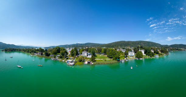 Pörtschach at the lake Woerthersee in Carinthia, Austria. Aerial view of the famous touristic place Poertschach at the lake Worthersee in Carinthia, South of Austria during summertime. pörtschach am wörthersee stock pictures, royalty-free photos & images