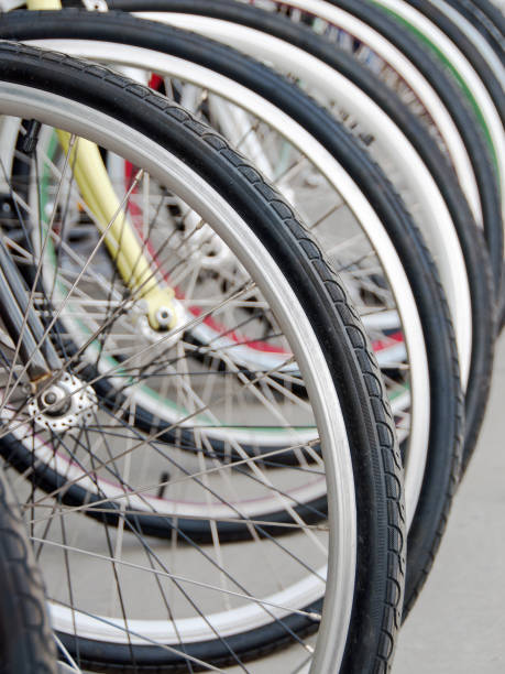 The front wheels of several new bikes... close-up.