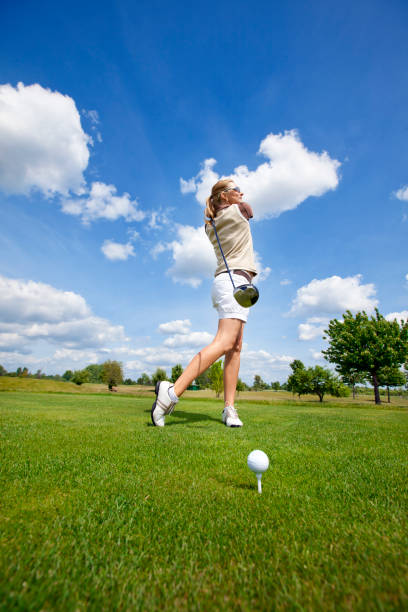 istock Woman Golfer taking a good golf swing 168504695