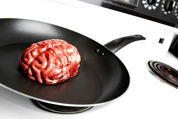 A brain is slowly fried in a frying pan.
