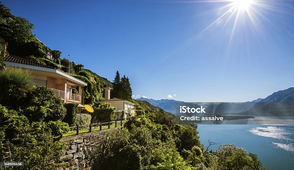 Summer cottages on a cliff at Lake Maggiore in Switzerland beautiful summer day in idyllic landscape. Come and visit Switzerland! Vacation Rental Stock Photo