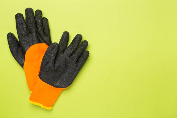 istock Garden gloves on color background, top view 1685055851