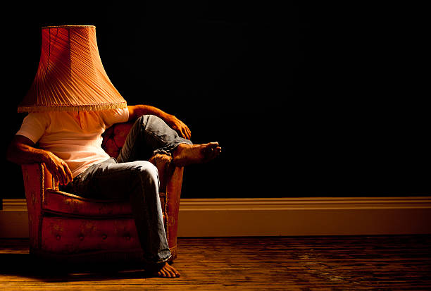 istock Domesticated man wearing lamp shade 168507540
