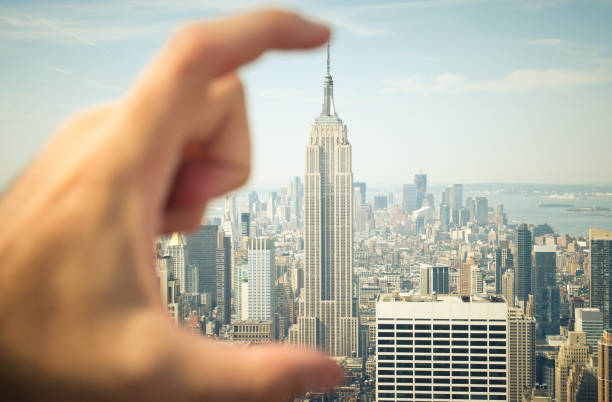istock The Empire State building in hand - Funny photo 168508052