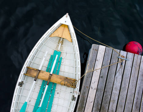 A beautiful traditional built rowboat is tied to a dock in Lunenburg Nova Scotia.  Click to see more Lunenburg images.