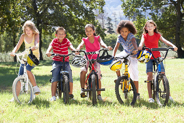 istock Children Riding Bikes In Countryside 168510087