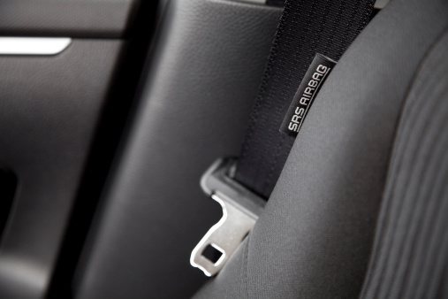 closeup of a car airbag sign and safety belt