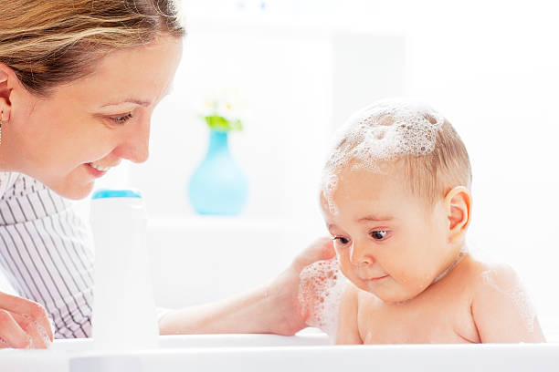 istock Mother and Daughter Having Fun in Baby Bath 168510327