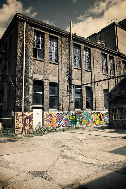 istock Old factory buildings facade, low-angle view 168510348