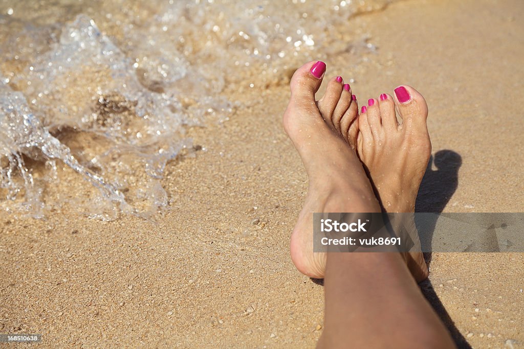 Sexy feet Female feet on the beach Sensuality Stock Photo