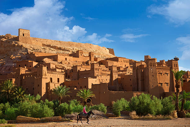 Morocco The magnificent fort of the Kasbah Ait Benhaddou. ass horse family photos stock pictures, royalty-free photos & images