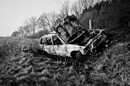burnt-out car by the roadside