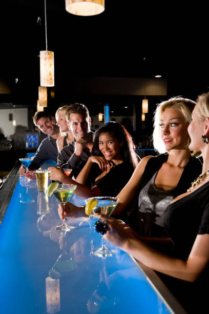 istock Group of people with drinks at nightclub bar 168514981