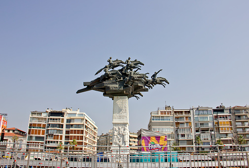 Izmir, Turkey - August 18, 2023: View of Gundogdu square. Gundogdu Meydani is an important meeting square by the sea in Alsancak, Konak in Izmir. There is a monument in the middle of the square representing Ataturk and chevaliers in the war of independence.