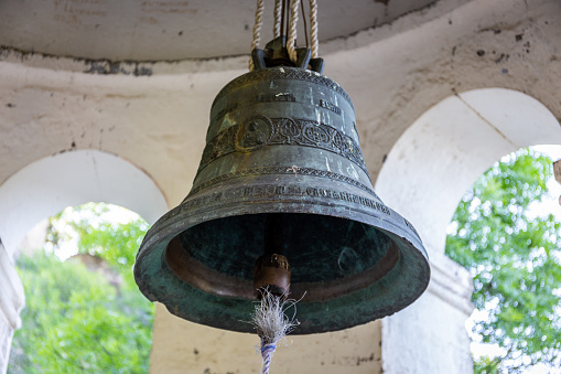 Ho Chi Minh city, Vietnam, February 27th, 2021: Copper bell in the old temple. This is an item used to signal for the time of service, a prayer, or spiritual relaxation in Ho Chi Minh city, Vietnam