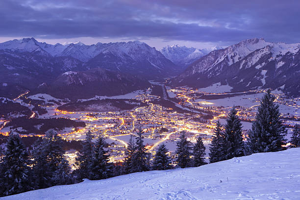 top view on reutte in the dawn, tirol, austria, winter top view on reutte in the dawn, tirol, austria, winter winter village austria tirol stock pictures, royalty-free photos & images