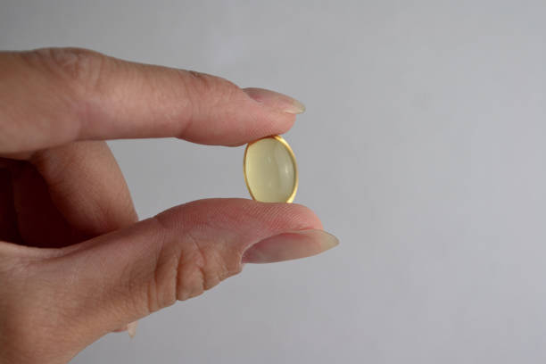 istock the girl is holding a pill 1685177892