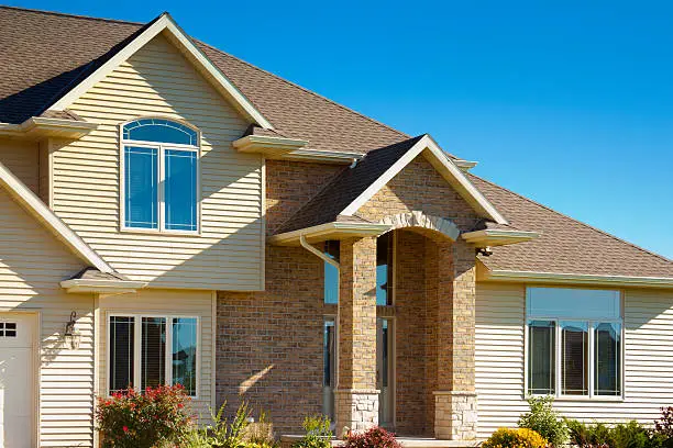 Photo of Mixed Materials House With Stone, Brick, Vinyl Siding