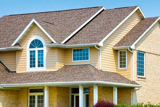 Photo of House with Brick, Architectural Vinyl Siding, Asphalt Shingle Roof