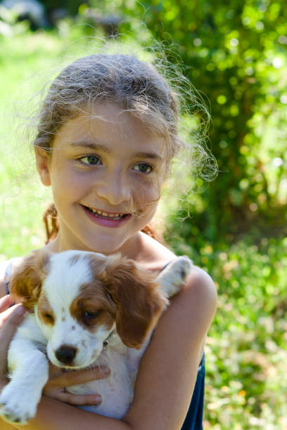 istock Little Girl with Her Dog 168518616