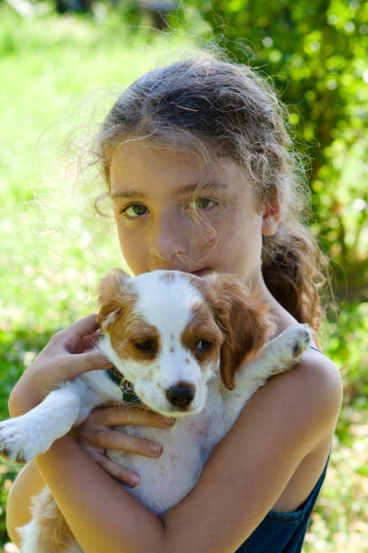 istock Little Girl with Her Dog 168518619