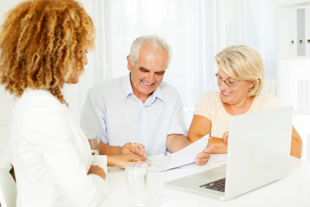 istock Senior Couple Meeting With Financial Advisor. 168518637