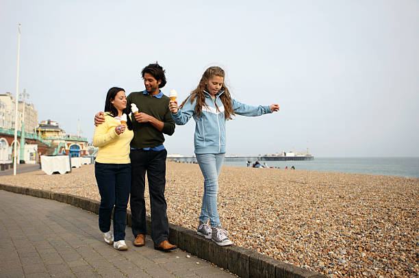istock Girl Eating Ice Cream with Parents 168518698